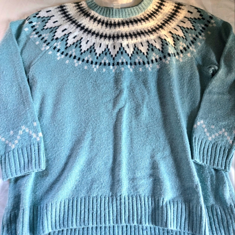 Beautiful blue CJ Banks sweater with white and black detailing around the neck.